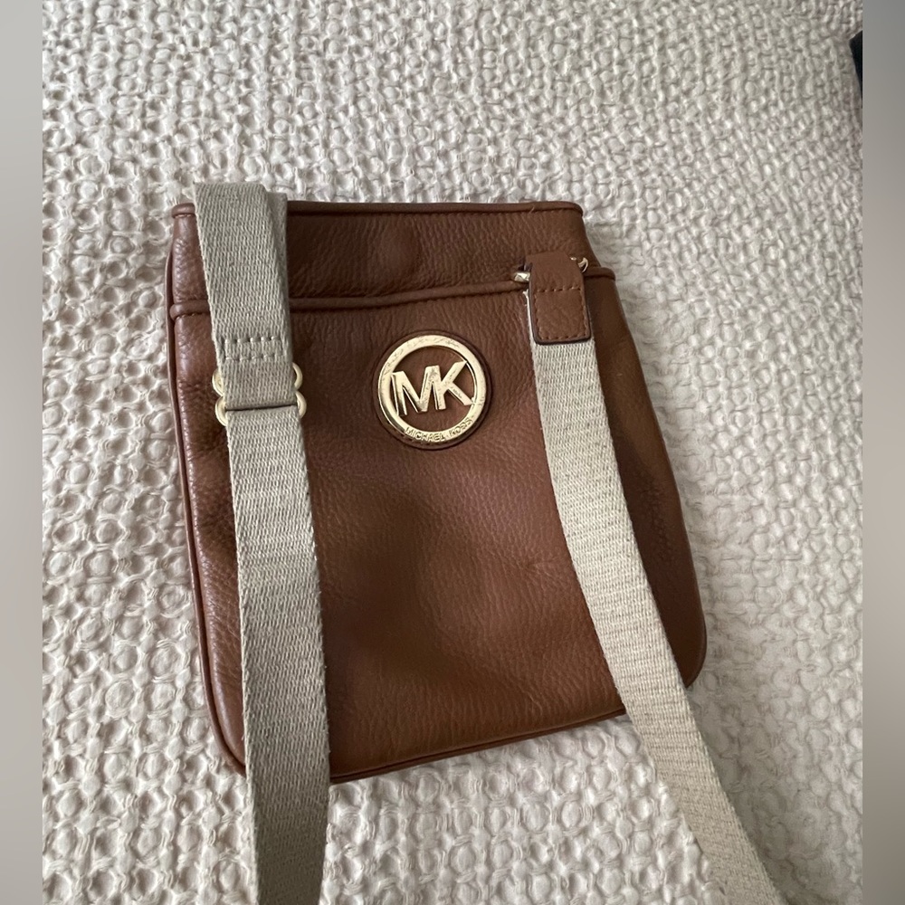 SOLD.   Micheal Kors cross body leather small